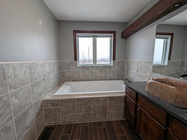 580 Canyon Ln NW, Eyota, MN 55934 - bathroom with a garden tub, vanity, and plenty of natural light