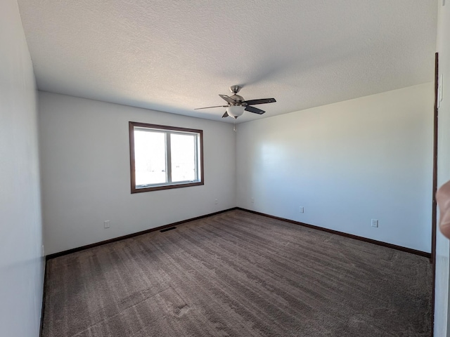 580 Canyon Ln NW, Eyota, MN 55934 - spare room with a ceiling fan, carpet flooring, a textured ceiling, and baseboards