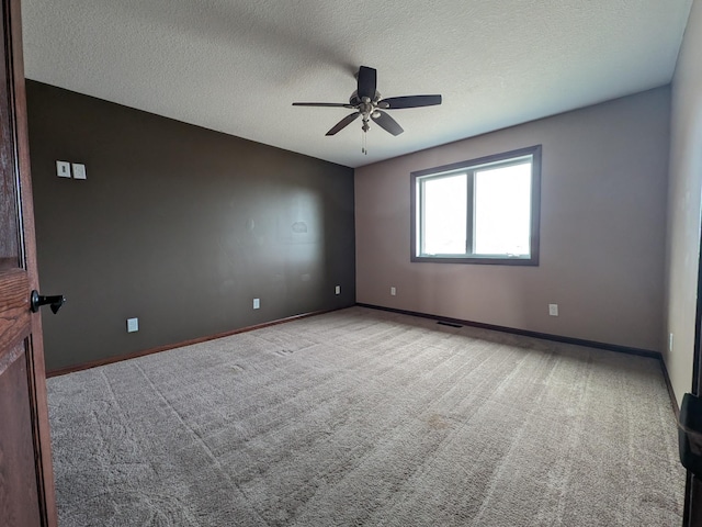 580 Canyon Ln NW, Eyota, MN 55934 - unfurnished room with ceiling fan, carpet flooring, a textured ceiling, and baseboards