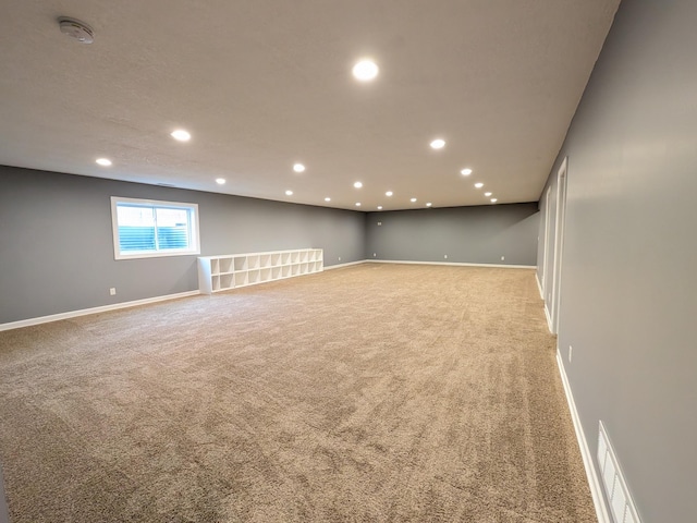 580 Canyon Ln NW, Eyota, MN 55934 - spare room featuring light colored carpet, recessed lighting, baseboards, and a smoke detector