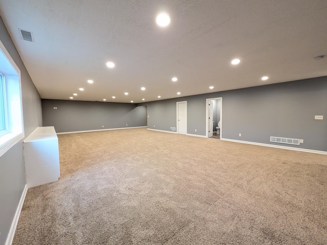 580 Canyon Ln NW, Eyota, MN 55934 - empty room with baseboards, light colored carpet, and recessed lighting