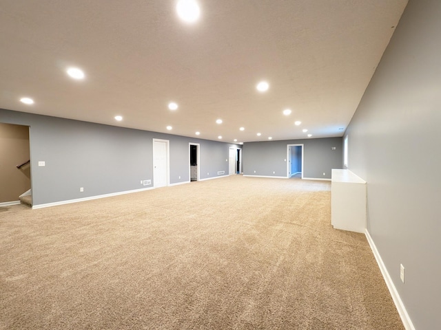 580 Canyon Ln NW, Eyota, MN 55934 - basement featuring light colored carpet, recessed lighting, baseboards, and stairway