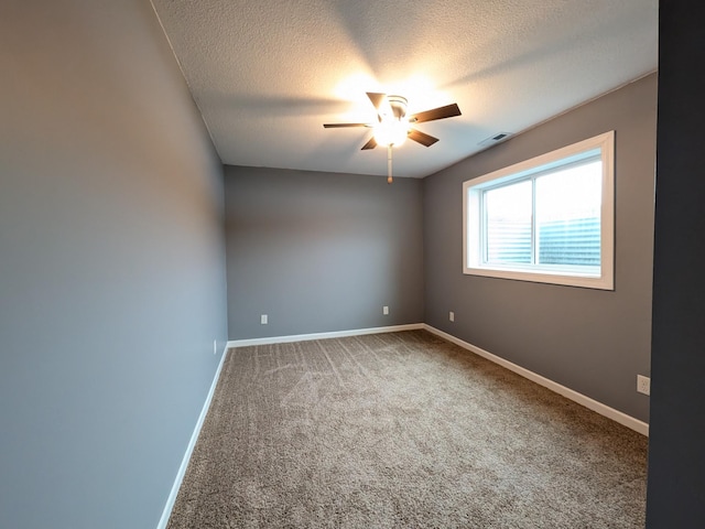 580 Canyon Ln NW, Eyota, MN 55934 - unfurnished room with a ceiling fan, carpet, baseboards, and a textured ceiling