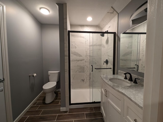 580 Canyon Ln NW, Eyota, MN 55934 - full bath with toilet, vanity, a shower stall, and recessed lighting