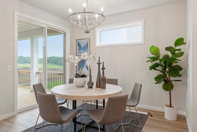 12439 Drayton Trl, Apple Valley, MN 55124 - dining room featuring a chandelier and light wood finished floors
