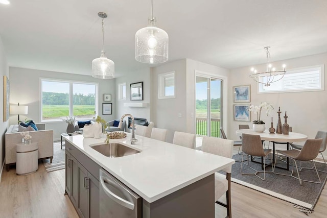12439 Drayton Trl, Apple Valley, MN 55124 - kitchen with dishwasher, open floor plan, light wood-style floors, and plenty of natural light