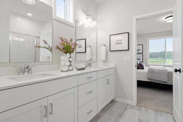12439 Drayton Trl, Apple Valley, MN 55124 - ensuite bathroom featuring double vanity and a stall shower