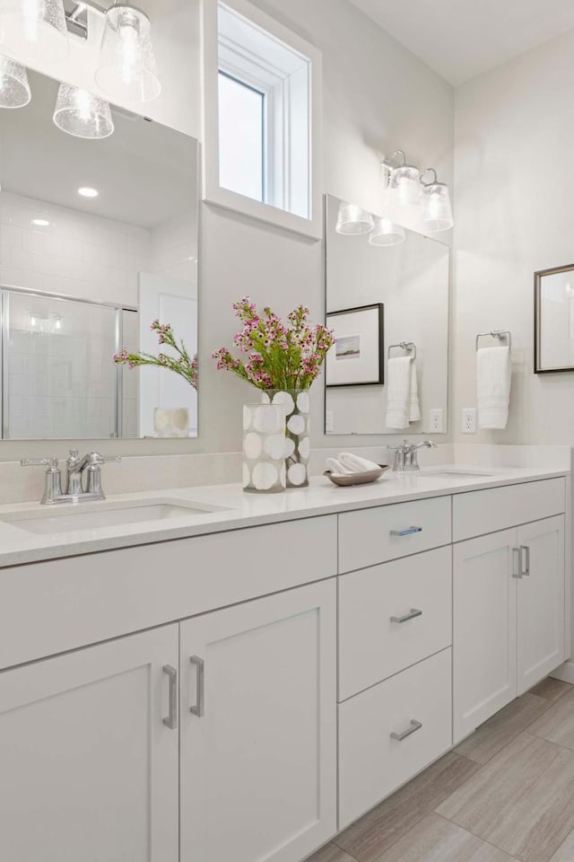 12439 Drayton Trl, Apple Valley, MN 55124 - bathroom featuring double vanity and a stall shower