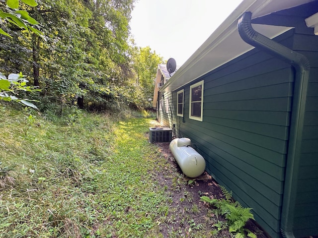 view of side of home with cooling unit