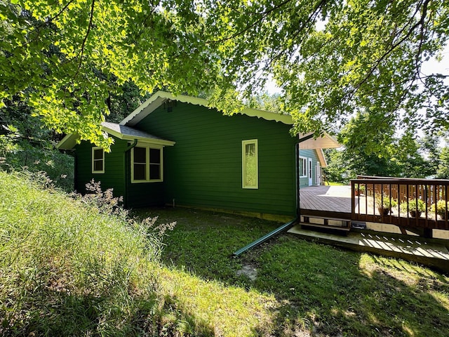 view of side of home with a deck