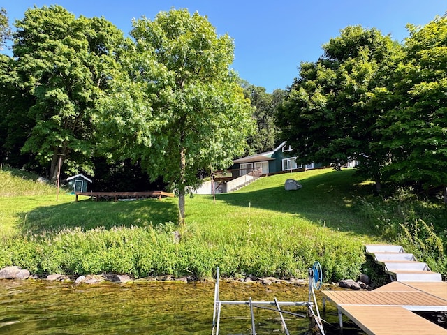 view of yard with a boat dock