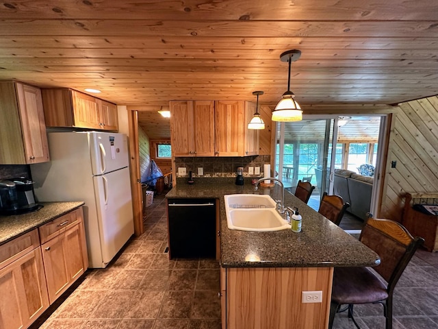 kitchen with a sink, dishwasher, a kitchen breakfast bar, a peninsula, and wooden ceiling