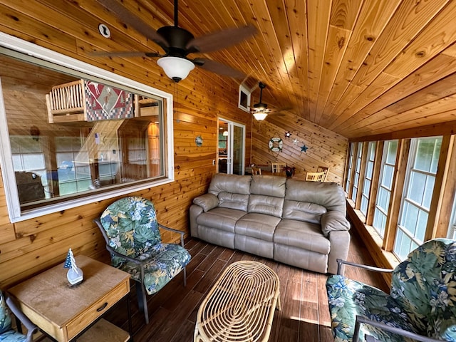 living room with wood-type flooring, ceiling fan, wooden walls, and wooden ceiling