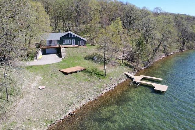 36018 504th St, Hobart Twp, MN 56544 - aerial view of property and surrounding area featuring a heavily wooded area and a large body of water