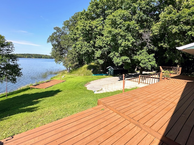 36018 504th St, Hobart Twp, MN 56544 - wooden deck with a water view and a yard