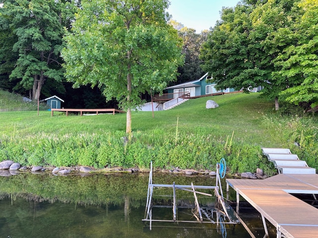 36018 504th St, Hobart Twp, MN 56544 - dock area with a water view and a yard