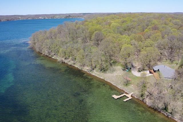 36018 504th St, Hobart Twp, MN 56544 - aerial view of a heavily wooded area and a nearby body of water
