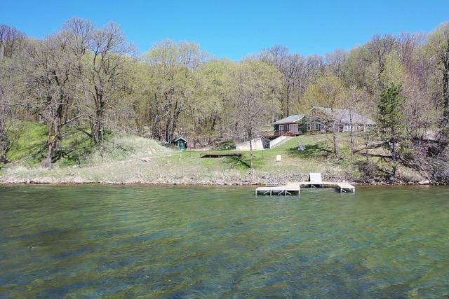 36018 504th St, Hobart Twp, MN 56544 - water view featuring a boat dock and a heavily wooded area