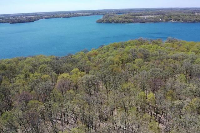 36018 504th St, Hobart Twp, MN 56544 - aerial view of property's location featuring a heavily wooded area and a large body of water