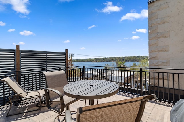 wooden terrace with a water view
