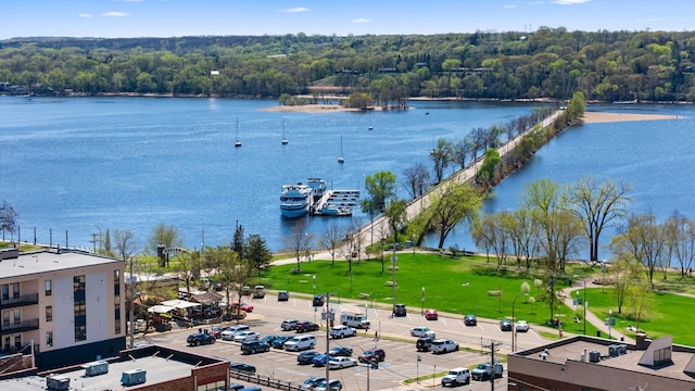 aerial view of a nearby body of water and a forest