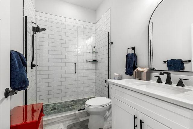full bathroom featuring a stall shower, toilet, marble finish floors, and vanity