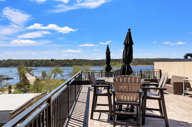 balcony featuring a water view