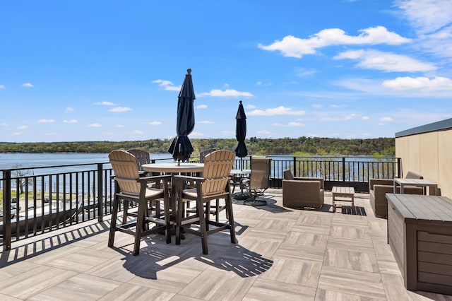 view of patio featuring a water view and an outdoor hangout area