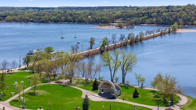 aerial view of a nearby body of water and a forest