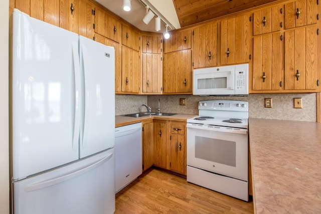 1844 Mount Carmel Dr NE, Alexandria, MN 56308 - kitchen with a sink, white appliances, tasteful backsplash, light wood-type flooring, and light countertops