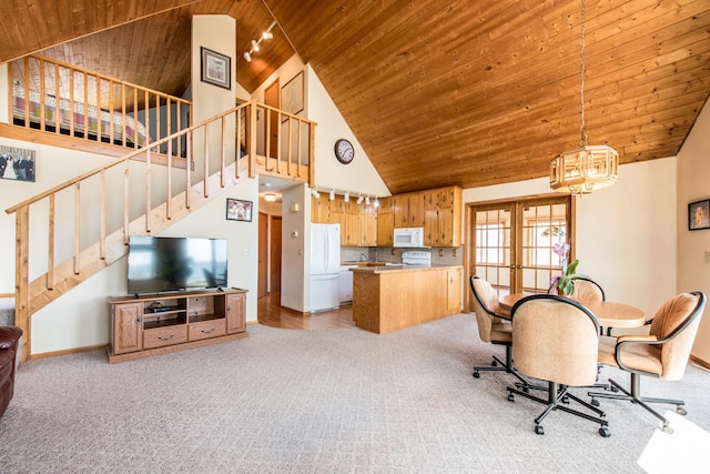 1844 Mount Carmel Dr NE, Alexandria, MN 56308 - dining space with wood ceiling, light carpet, stairs, and high vaulted ceiling