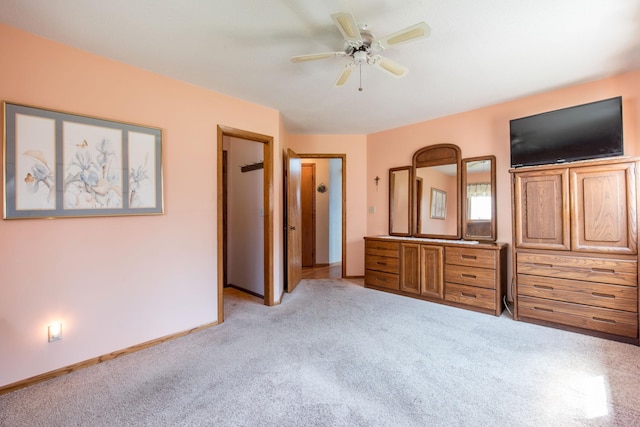 1844 Mount Carmel Dr NE, Alexandria, MN 56308 - unfurnished bedroom featuring light colored carpet, baseboards, and a ceiling fan