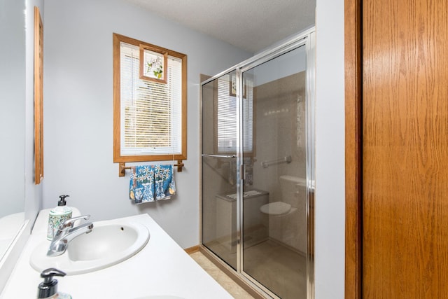 1844 Mount Carmel Dr NE, Alexandria, MN 56308 - full bathroom with a sink, double vanity, toilet, and a stall shower