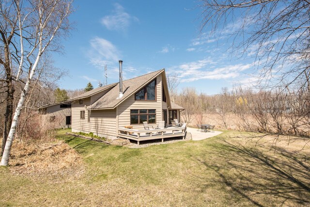 1844 Mount Carmel Dr NE, Alexandria, MN 56308 - back of property featuring a yard and a wooden deck