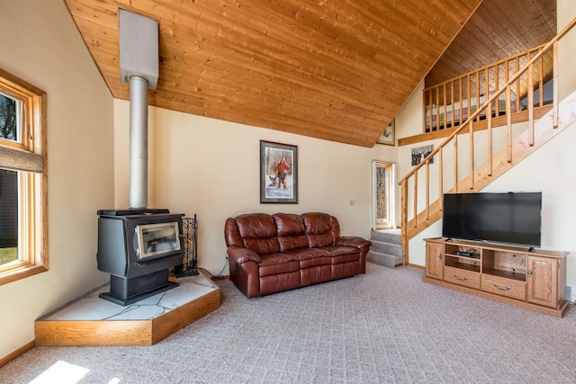 1844 Mount Carmel Dr NE, Alexandria, MN 56308 - living room featuring carpet, stairway, wood ceiling, high vaulted ceiling, and a wood stove