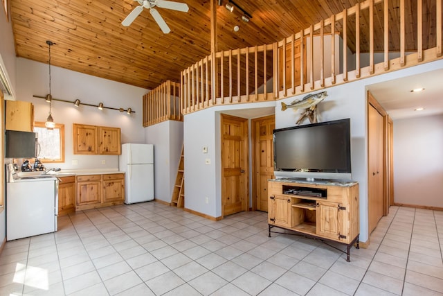 1844 Mount Carmel Dr NE, Alexandria, MN 56308 - kitchen featuring high vaulted ceiling, freestanding refrigerator, light countertops, light tile patterned flooring, and range with electric stovetop