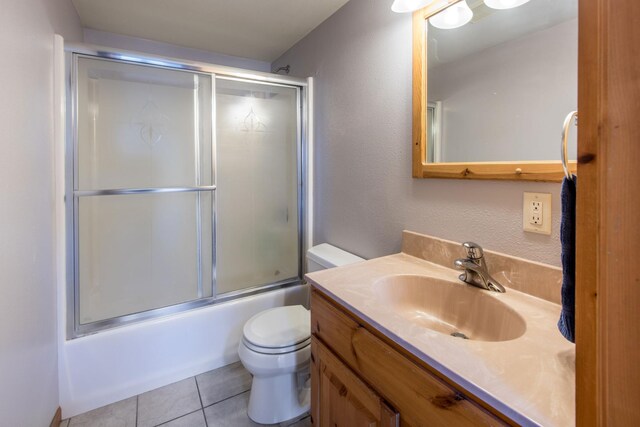 1844 Mount Carmel Dr NE, Alexandria, MN 56308 - full bath with toilet, tile patterned flooring, vanity, and shower / bath combination with glass door