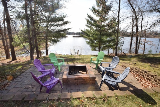 3585 Rigby Rd, Webster, WI 54893 - view of patio featuring a water view and a fire pit