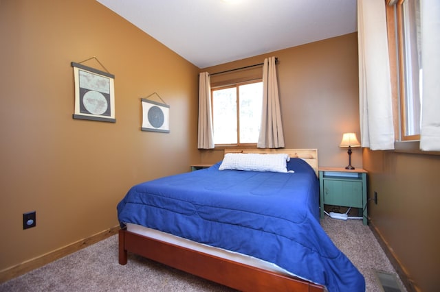 3585 Rigby Rd, Webster, WI 54893 - carpeted bedroom featuring baseboards and vaulted ceiling