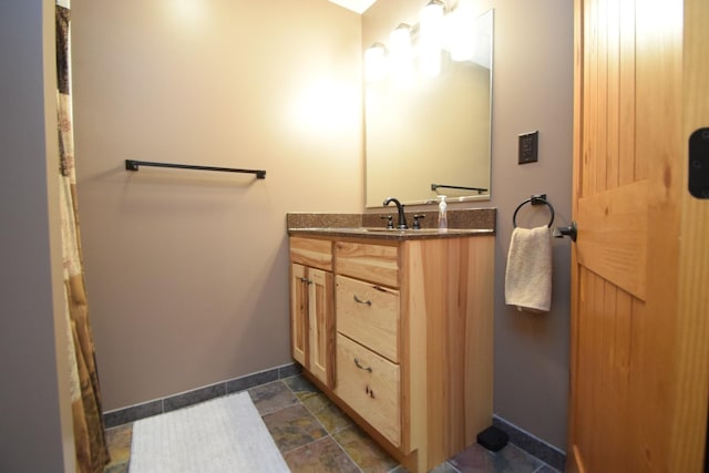 3585 Rigby Rd, Webster, WI 54893 - full bath with baseboards, stone finish flooring, and vanity