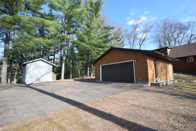 3585 Rigby Rd, Webster, WI 54893 - view of home's exterior featuring a detached garage and an outbuilding