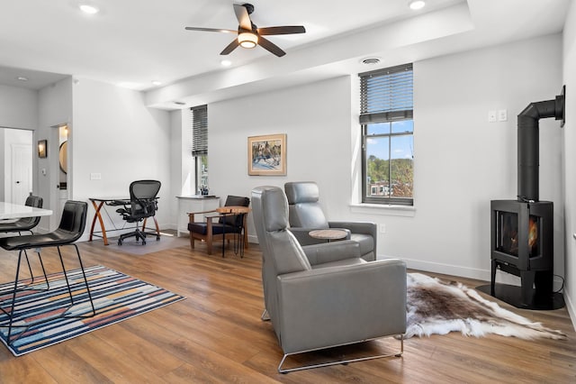 517 2nd St Unit 303, Hudson, WI 54016 - living area with a ceiling fan, wood finished floors, recessed lighting, a wood stove, and baseboards