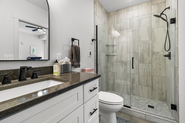 517 2nd St Unit 303, Hudson, WI 54016 - bathroom featuring a shower stall, toilet, vanity, and a ceiling fan