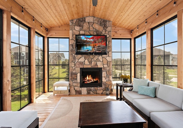 sunroom with wood ceiling, wood-type flooring, and lofted ceiling