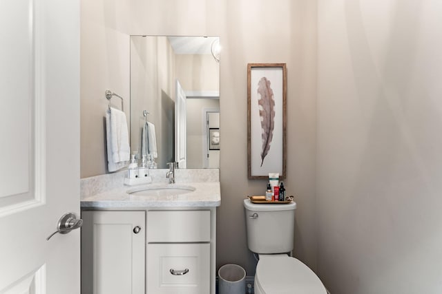 bathroom with toilet and vanity