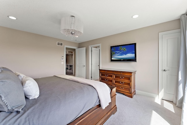 bedroom with baseboards, light colored carpet, recessed lighting, and visible vents