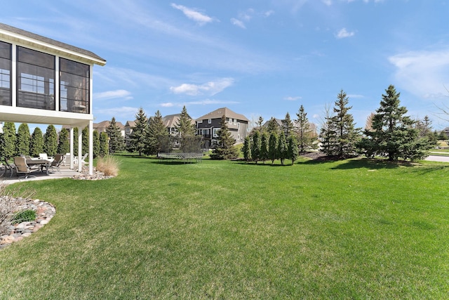 view of yard with a patio and a trampoline