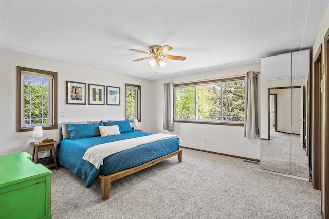 2895 Thunder Bay Ct, Little Canada, MN 55117 - carpeted bedroom with a textured ceiling, baseboards, and ceiling fan