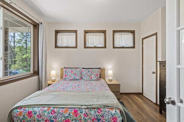 2895 Thunder Bay Ct, Little Canada, MN 55117 - bedroom with wood finished floors and baseboards