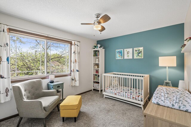 2895 Thunder Bay Ct, Little Canada, MN 55117 - bedroom with carpet, baseboards, a textured ceiling, ceiling fan, and a crib